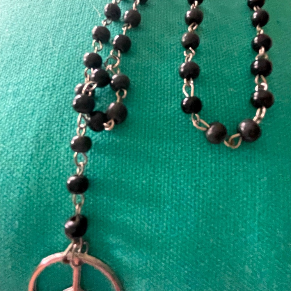 Beaded necklace with Peace sign pendant.
